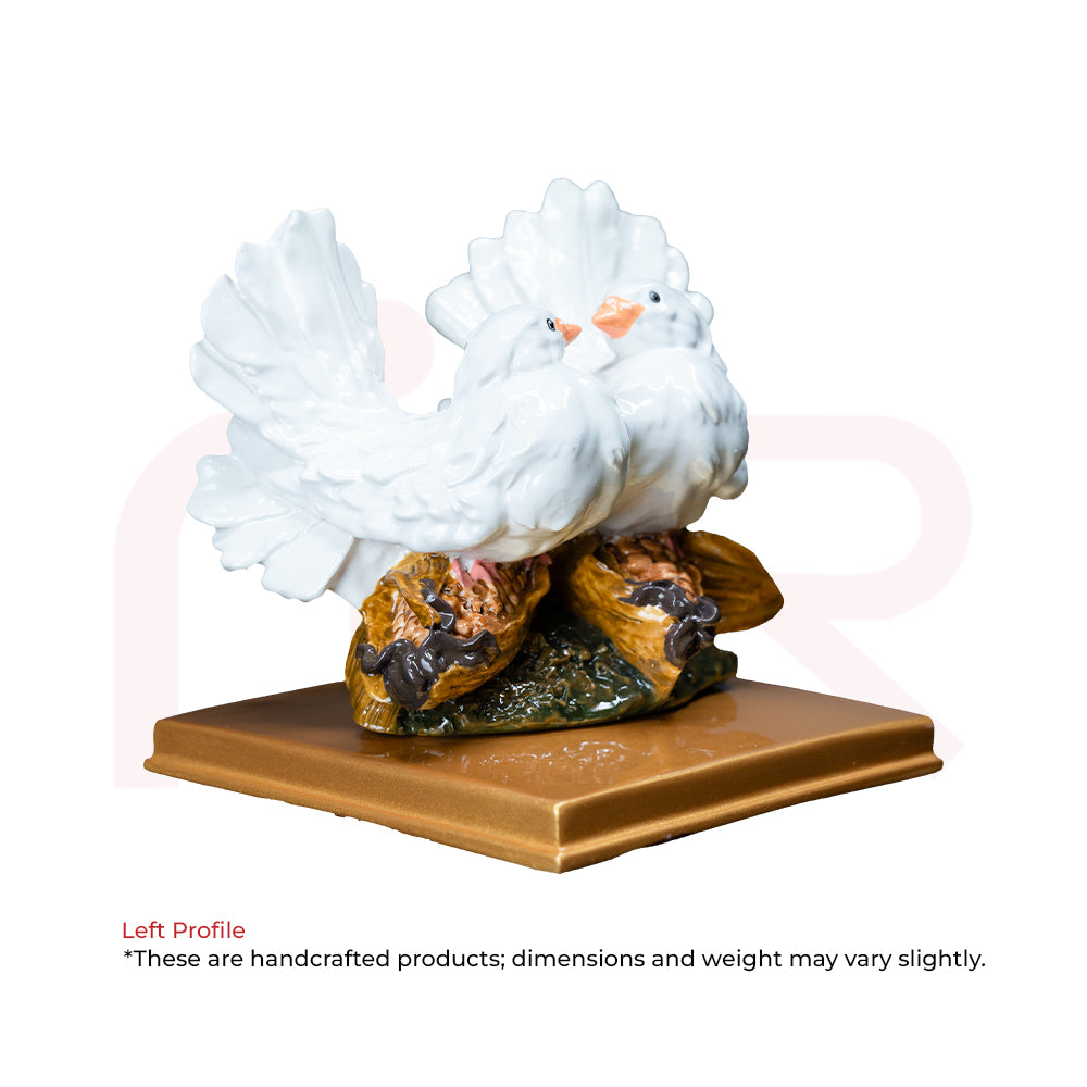 Handcrafted Vastu remedy statue of white love birds perched on a golden base, for harmony