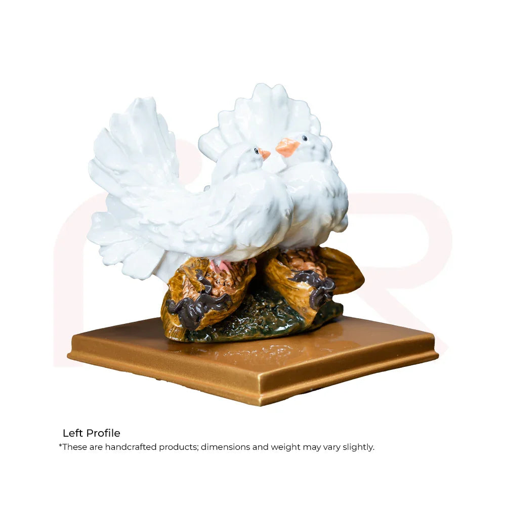 White ceramic pair of love birds figurine on a gold base for Vastu prosperity.