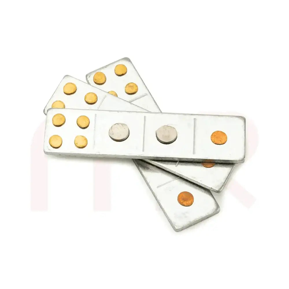 Set of metal strips with brass and silver colored dots for Vastu remedy applications.