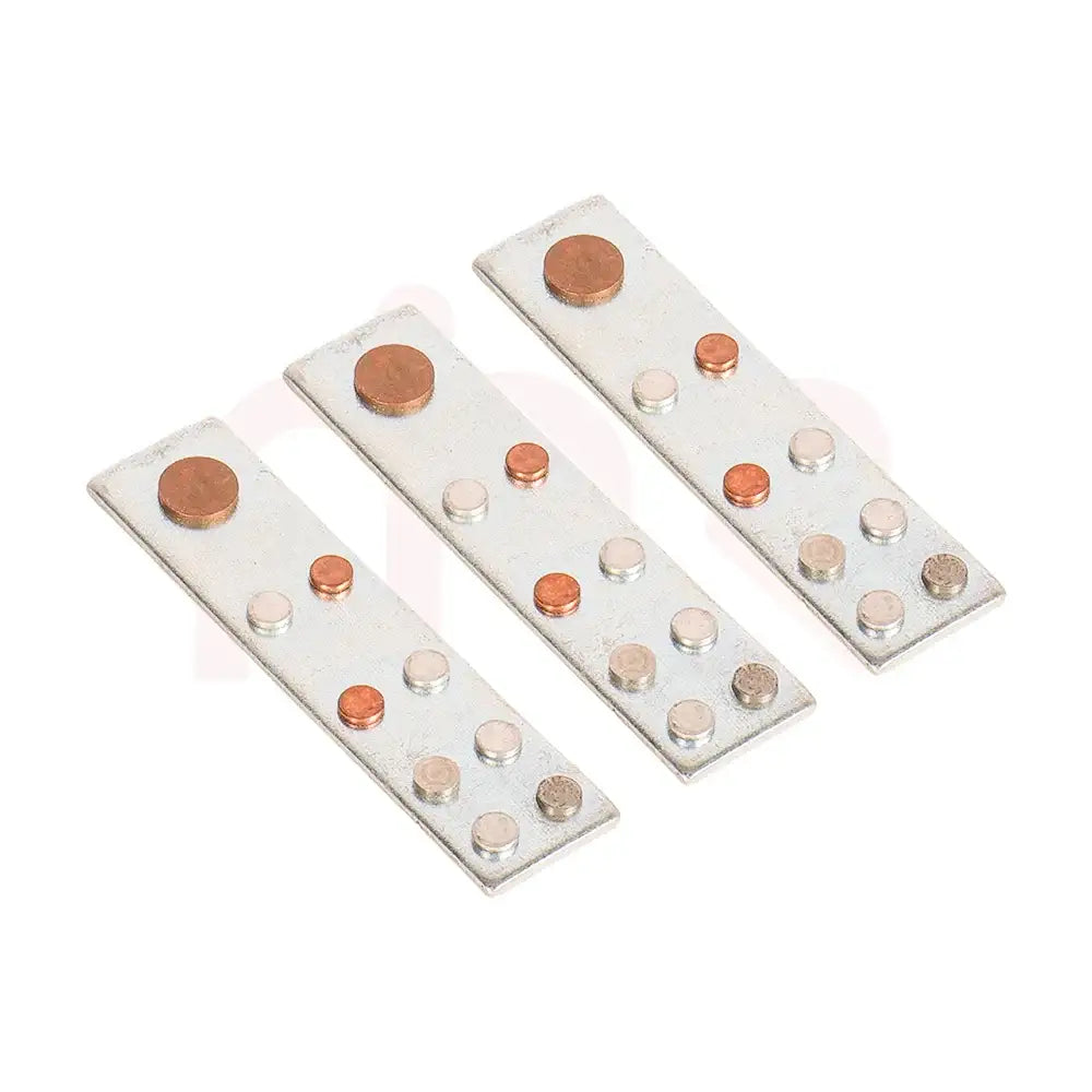 Set of three silver metal strips with copper and silver dots for Vastu remedies.
