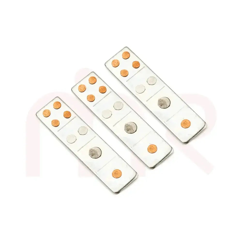 Three silver metal strips with copper and silver dots for Vastu Shastra remedies.