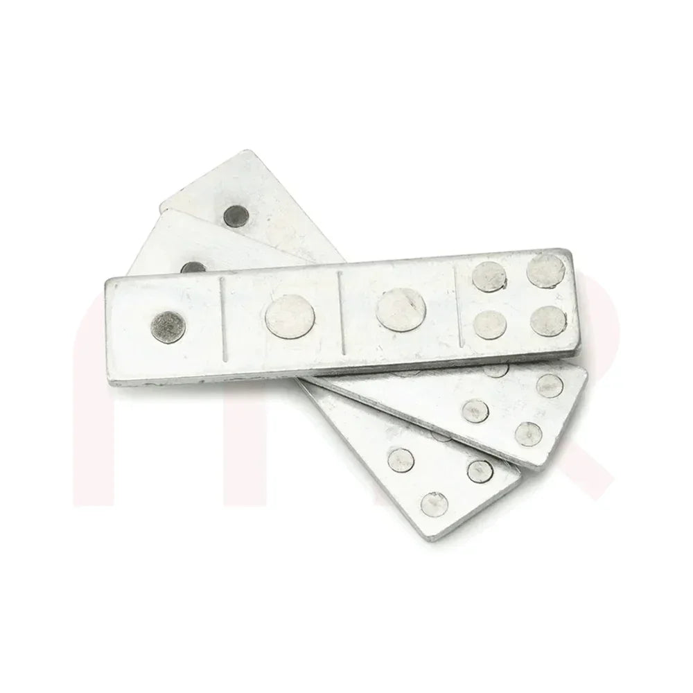 Set of silver Vastu metal strips for MahaVastu remedies on a white background