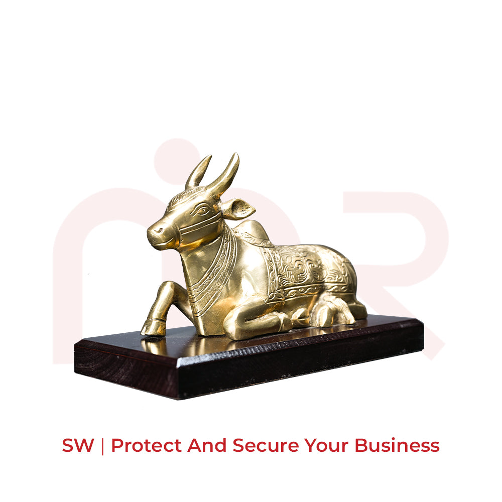 Brass Nandi idol for Vastu remedies on a wooden base, ideal for home or office decor