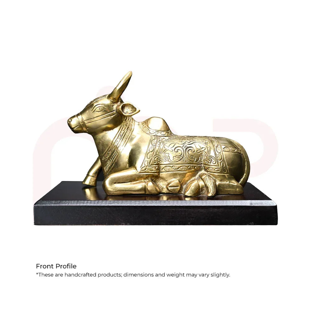 Brass Nandi bull idol with intricate carvings, Vastu decor statue on black base