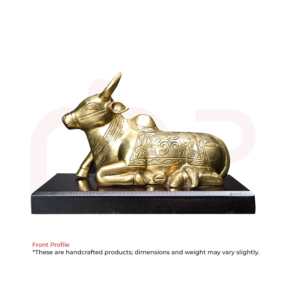 Brass Nandi bull idol with intricate carvings, Vastu decor statue on black base