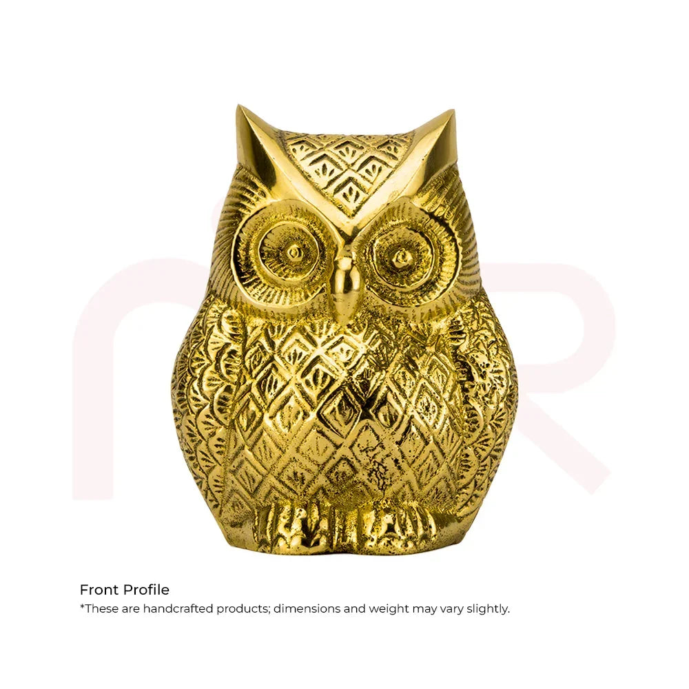 Front view of a handcrafted golden owl idol with detailed patterns, used for Vastu remedies.