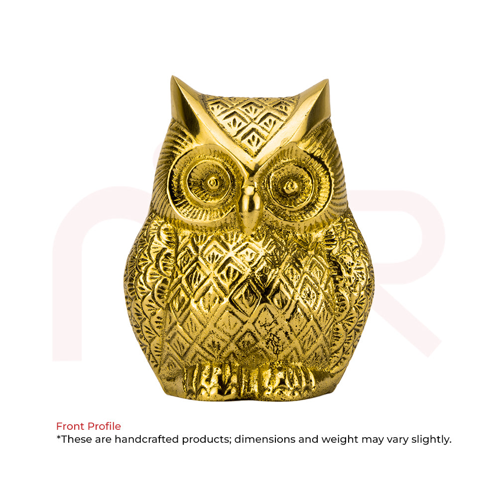Front view of a handcrafted golden owl idol with detailed patterns, used for Vastu remedies.