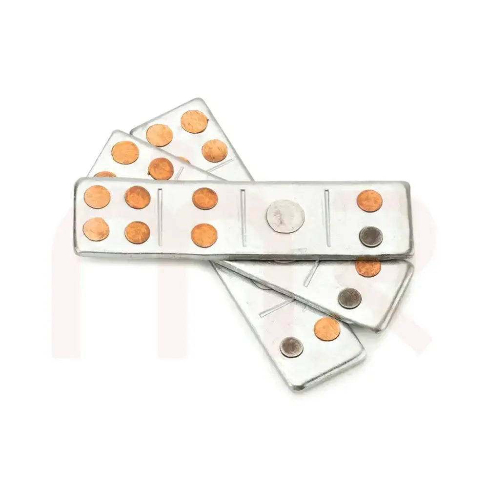 Metal strips with copper and silver dots for Vastu remedy and energy balancing.