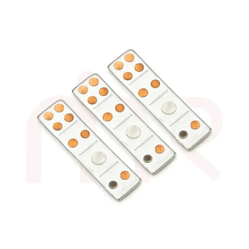 Three silver metal strips with copper and iron studs for Maha Vastu remedies.