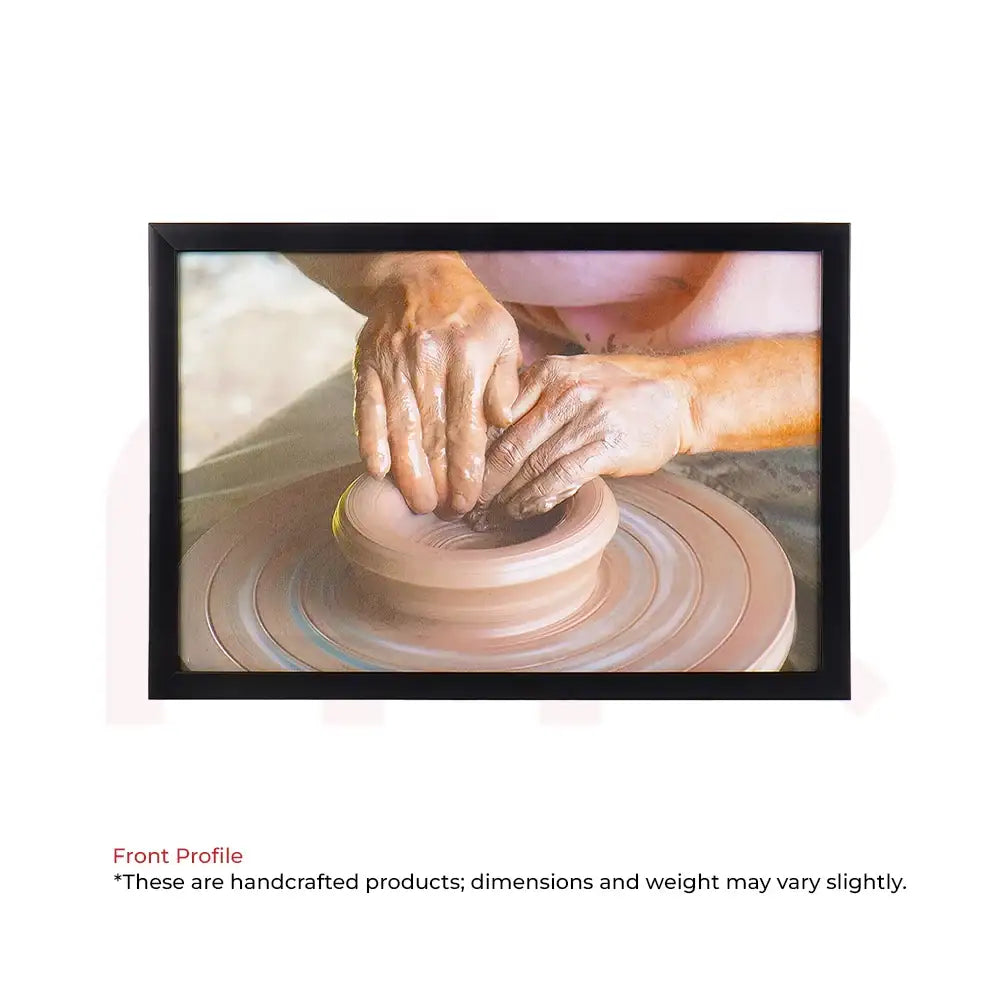 Framed Vastu painting of hands shaping clay on pottery wheel for positive energy and harmony