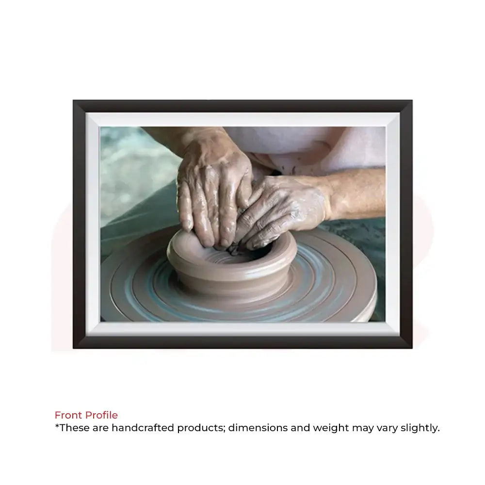 Framed Vastu painting of hands shaping clay on pottery wheel for positive energy and prosperity