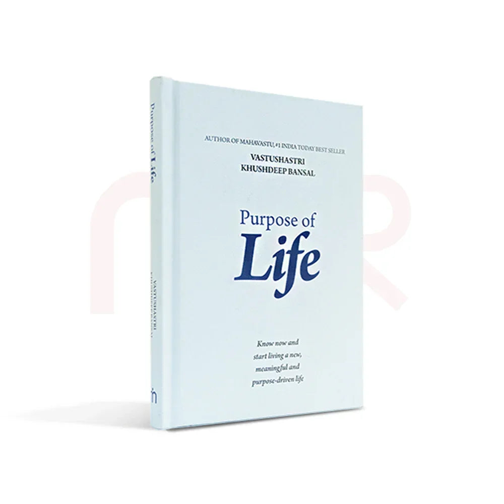 Purpose of Life book by Vastu expert on white background, self-help and positivity guide