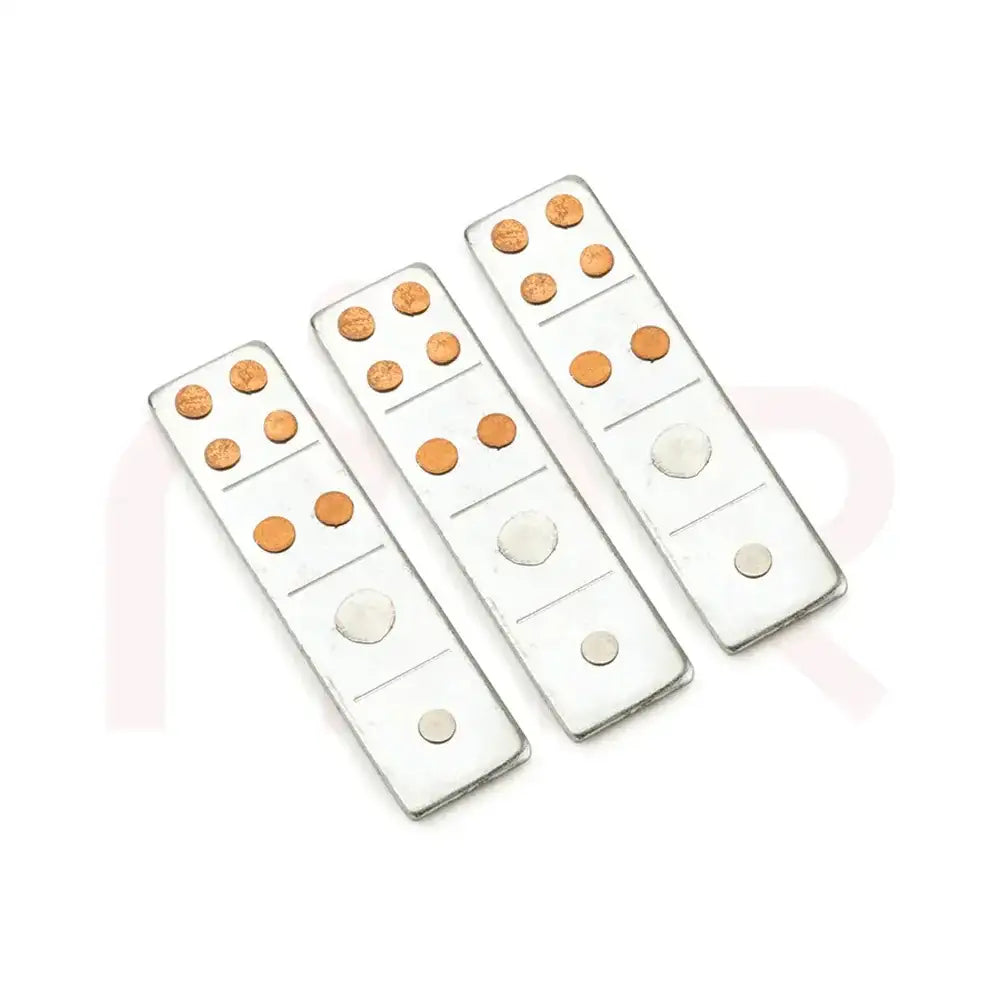 Three silver metal strips with copper studs for Vastu Shastra remedies.