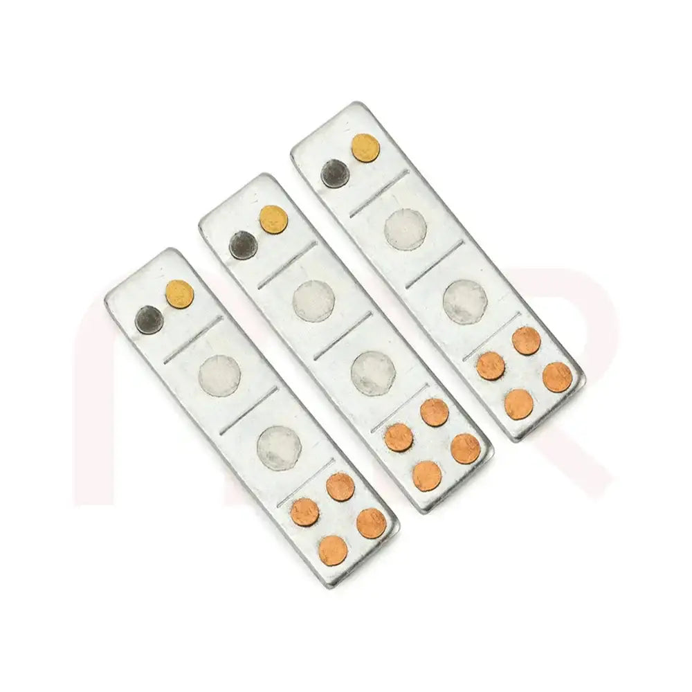 Three silver metal strips with copper and brass studs for Vastu Shastra remedies.
