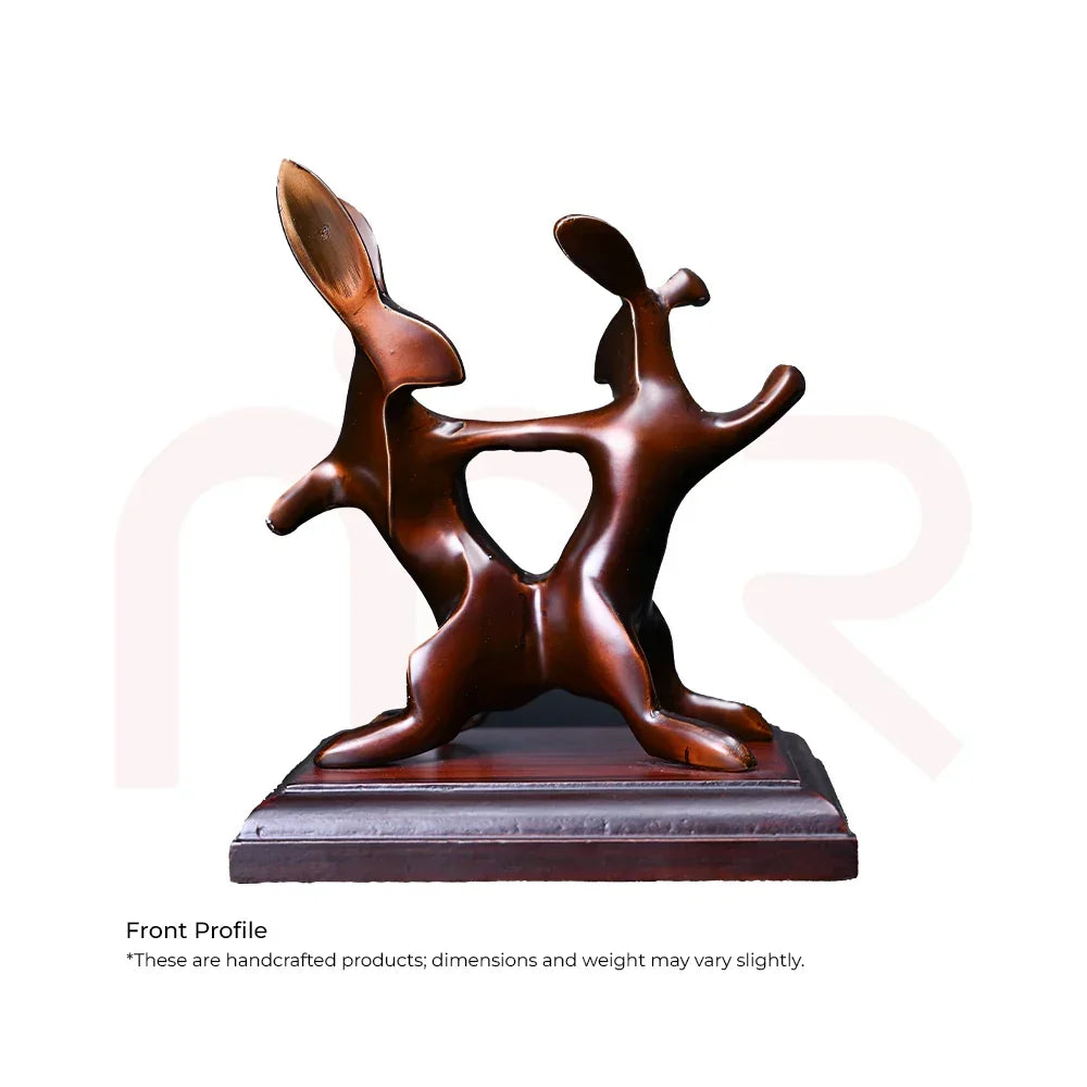 Handcrafted brown rabbit figurine, abstract design, on a wooden base, Vastu decor.
