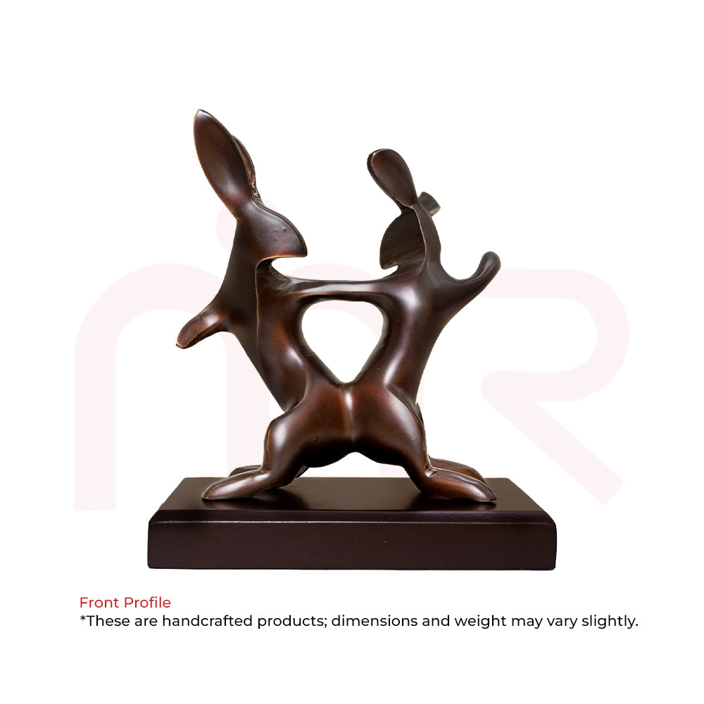 Handcrafted brown rabbit figurine, abstract design, on a wooden base, Vastu decor.