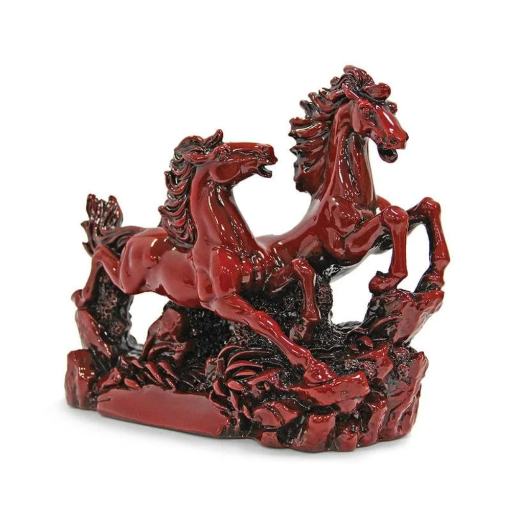 Maha Vastu Dynamic red sculpture of two horses in motion, showcasing strength and grace with intricate mane and tail details on a white background, to be placed in southeast direction as per principles of vastu shastra.