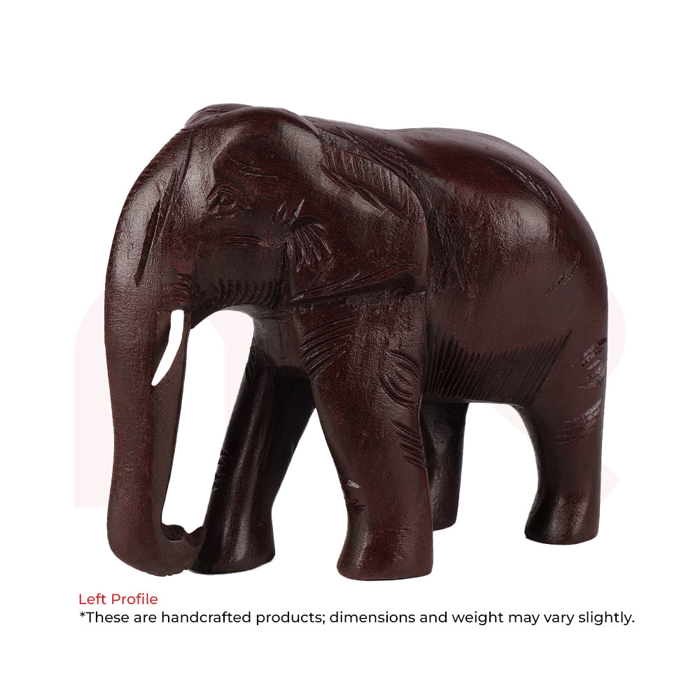 Handcrafted red elephant figurine for Vastu decor, carved wooden ornament.