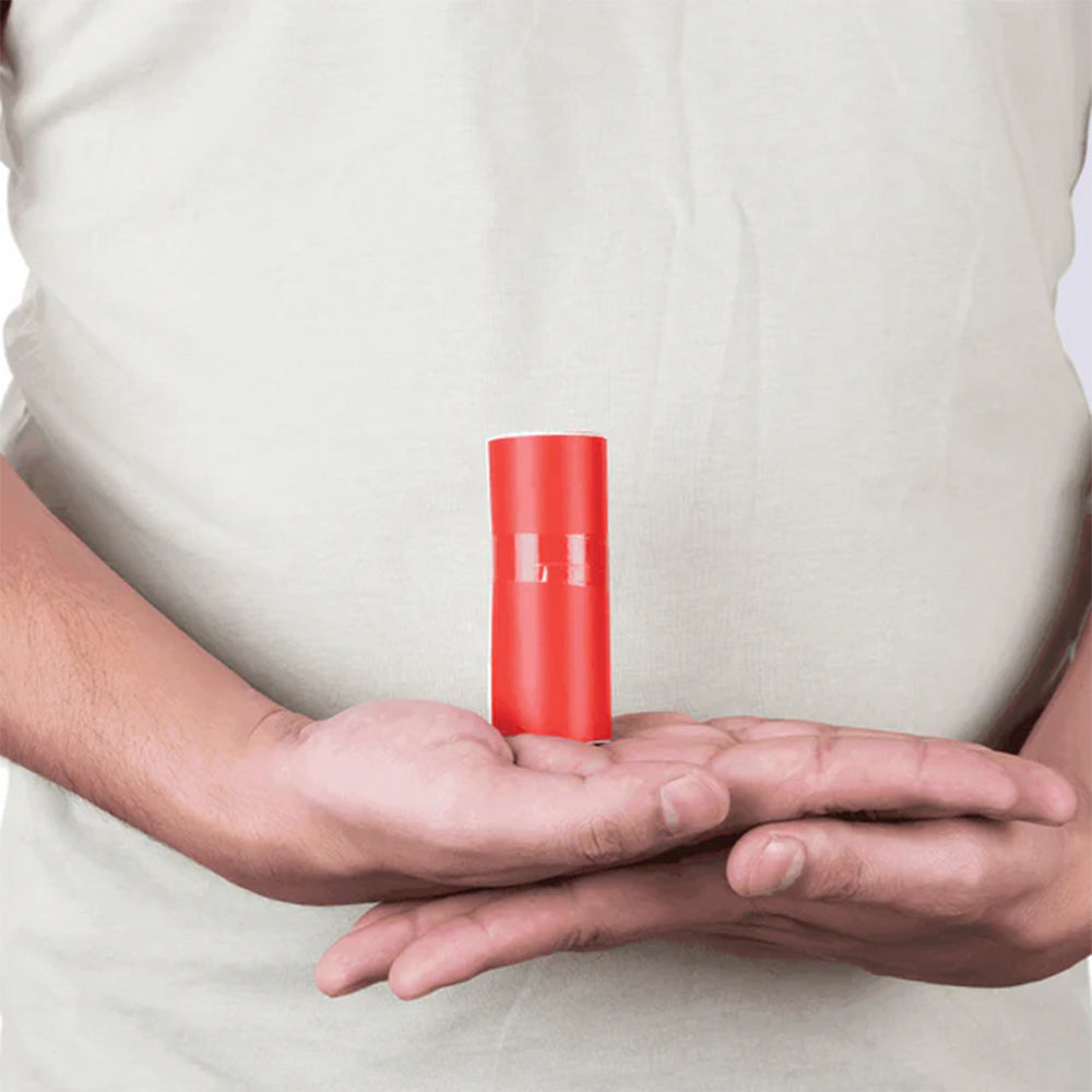 Person holding MahaVastu red color tape remedy for Vastu Shastra in open palms