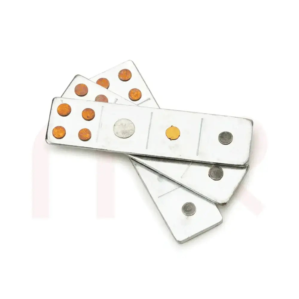 Silver metal strips with copper and brass dots for Maha Vastu remedies.