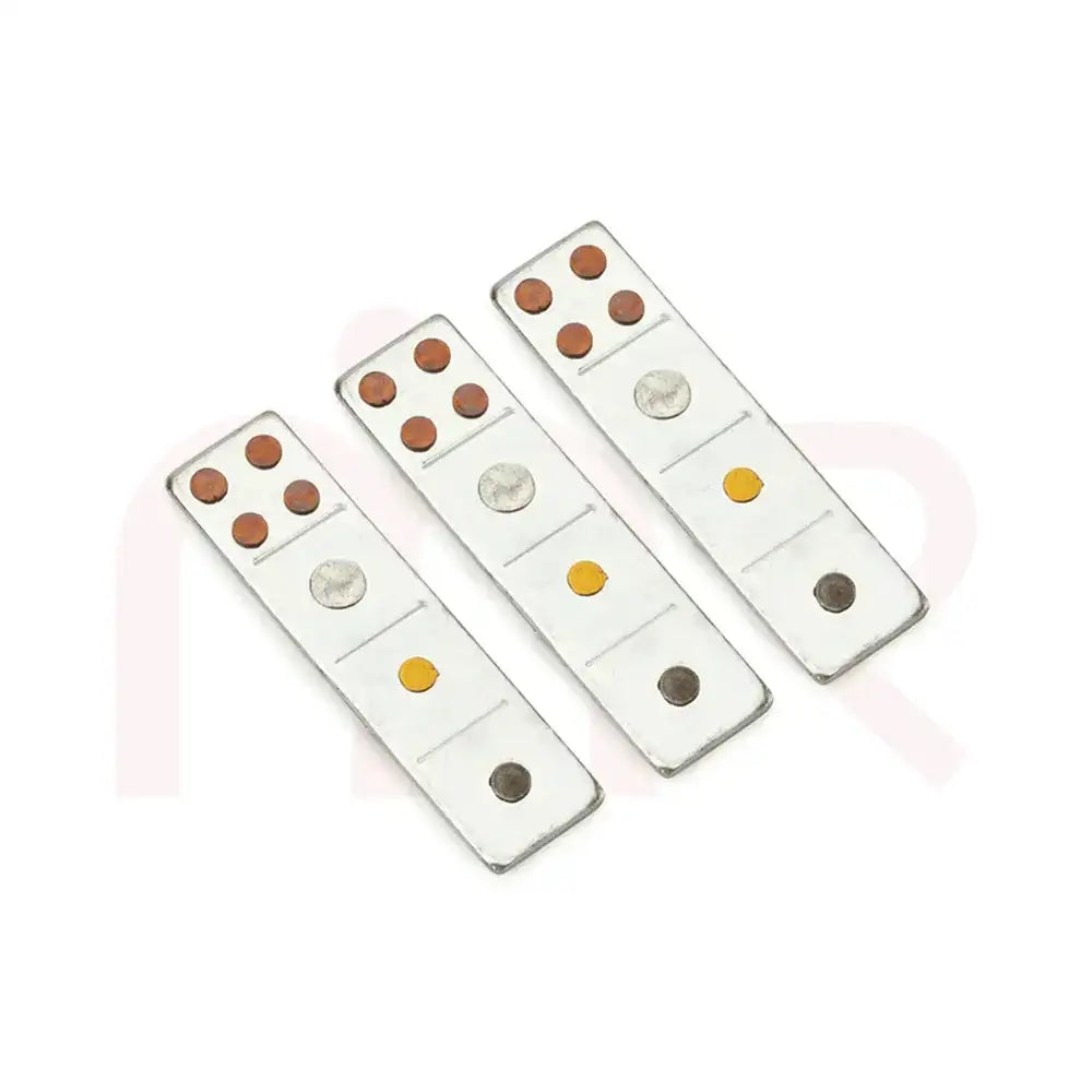 Three silver Maha Vastu metal strips with copper and brass dots for energy balancing.