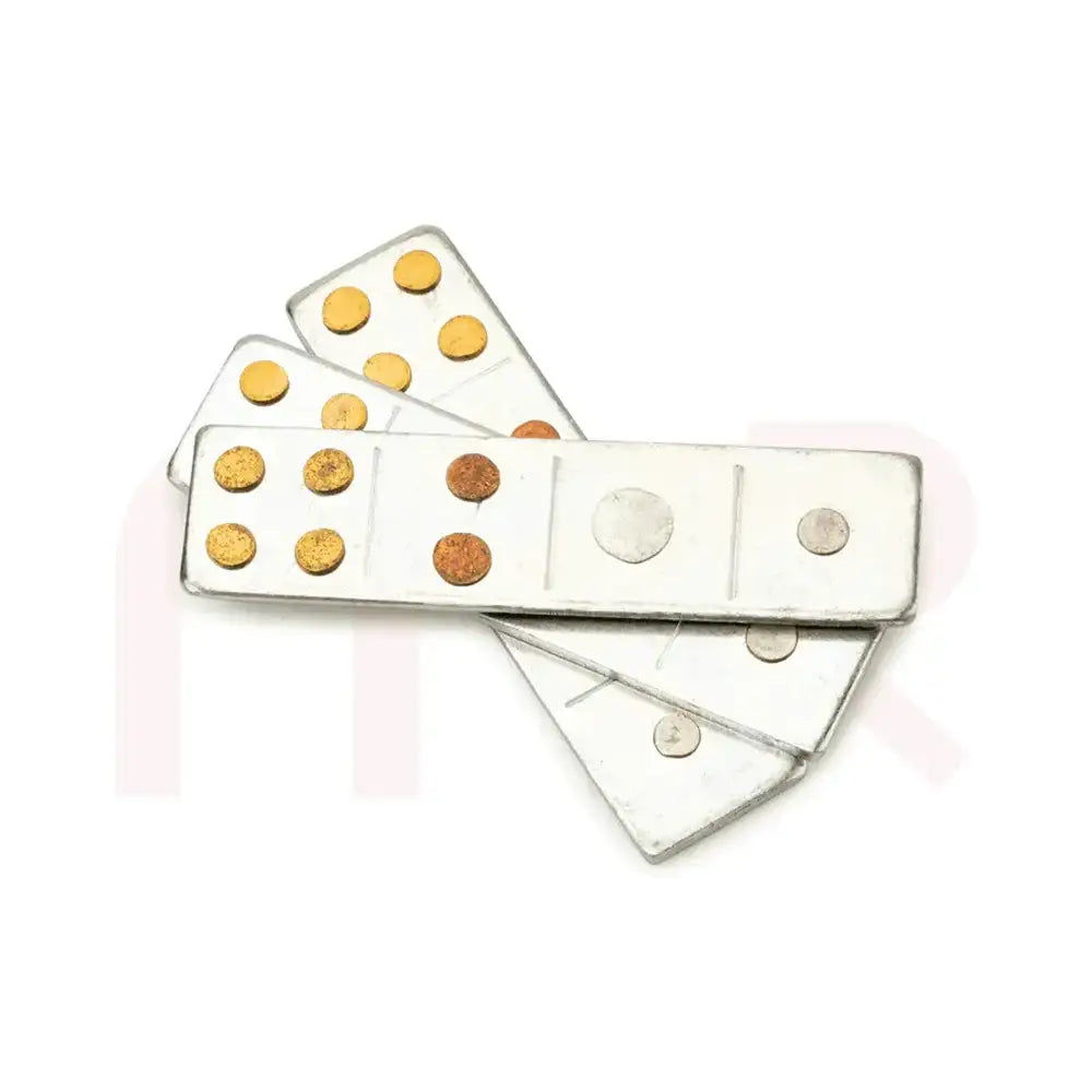 Vastu metal strips with gold and silver dots for energy balancing and remedies.