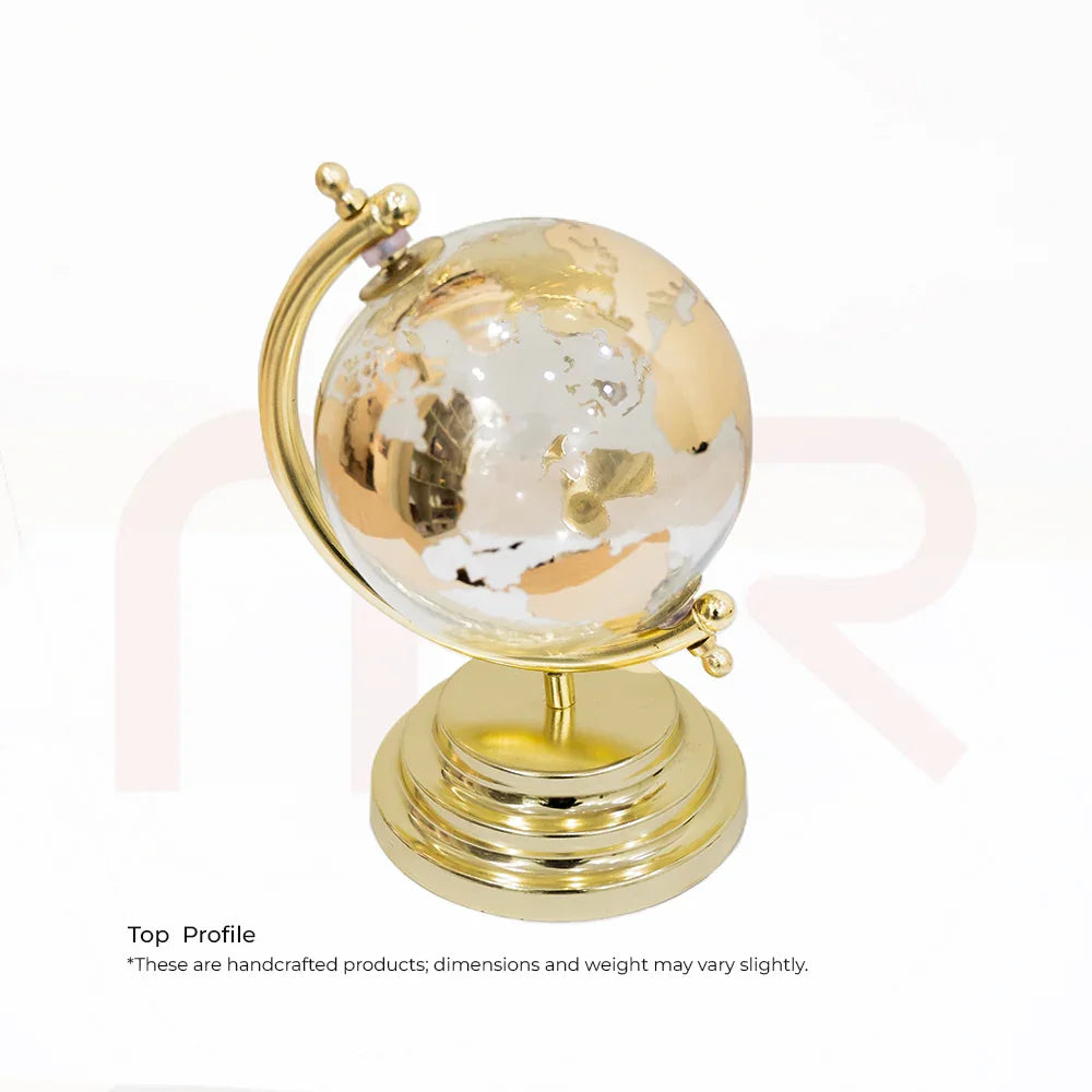 Handcrafted golden globe MahaVastu remedy on polished stand for Vastu balance and positivity