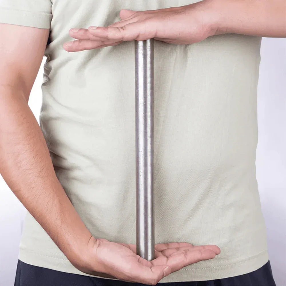 Person holding a stainless steel Vastu remedy metal strip for MahaVastu home balance