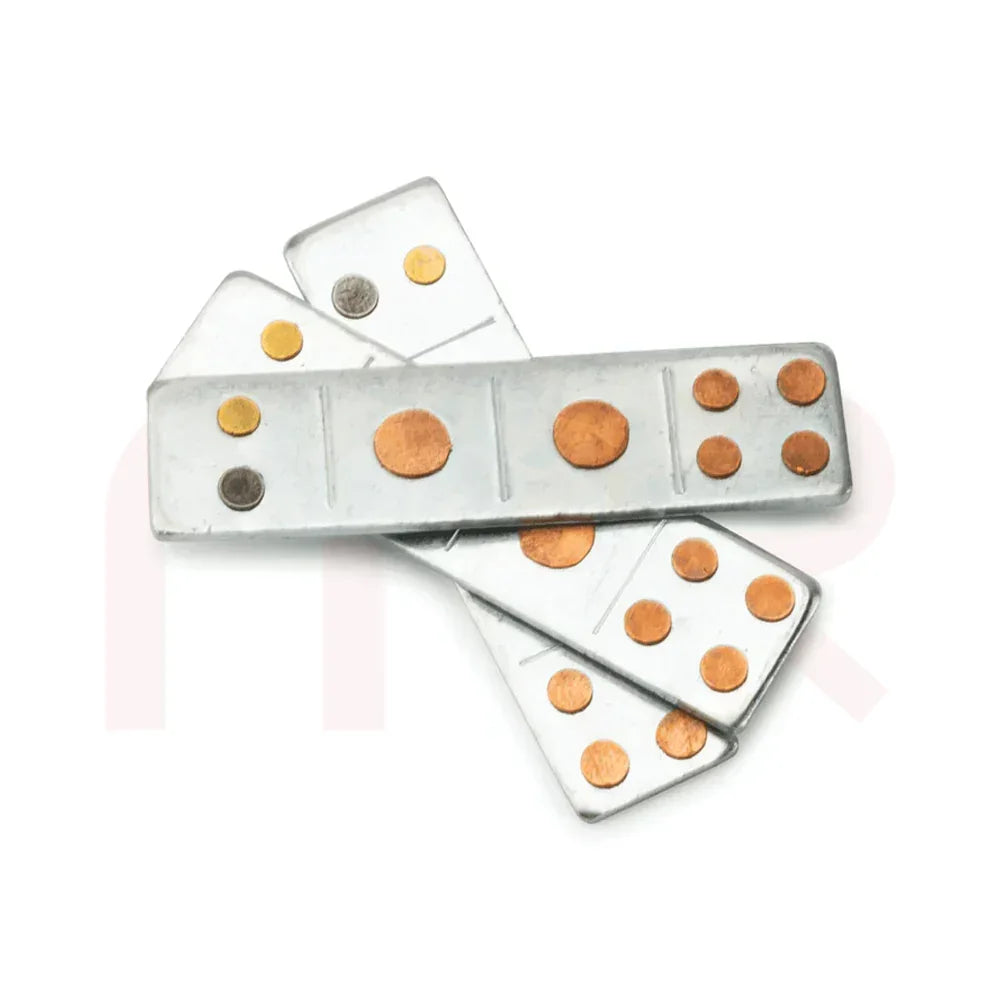 Vastu remedy metal strips with copper and brass dots on white background
