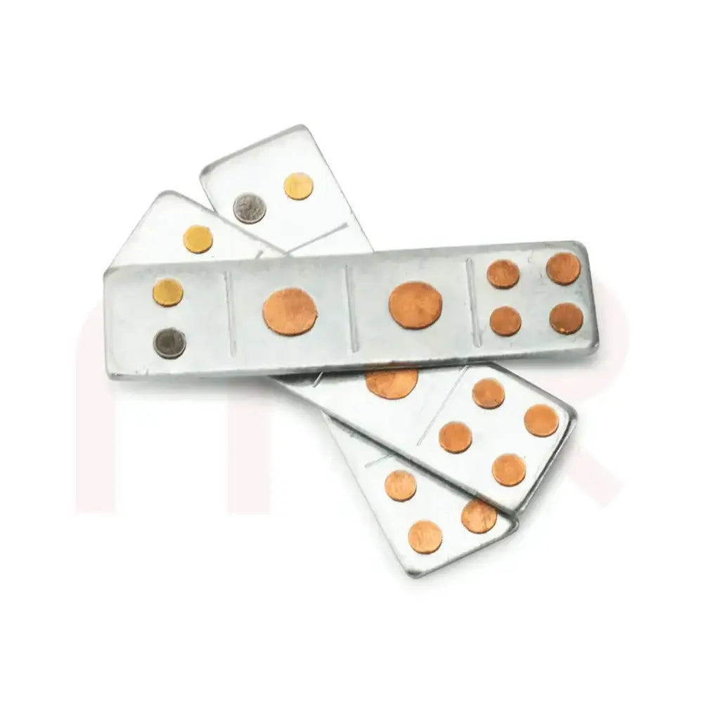 Metal strips with copper and brass dots for Vastu remedy and energy balancing.