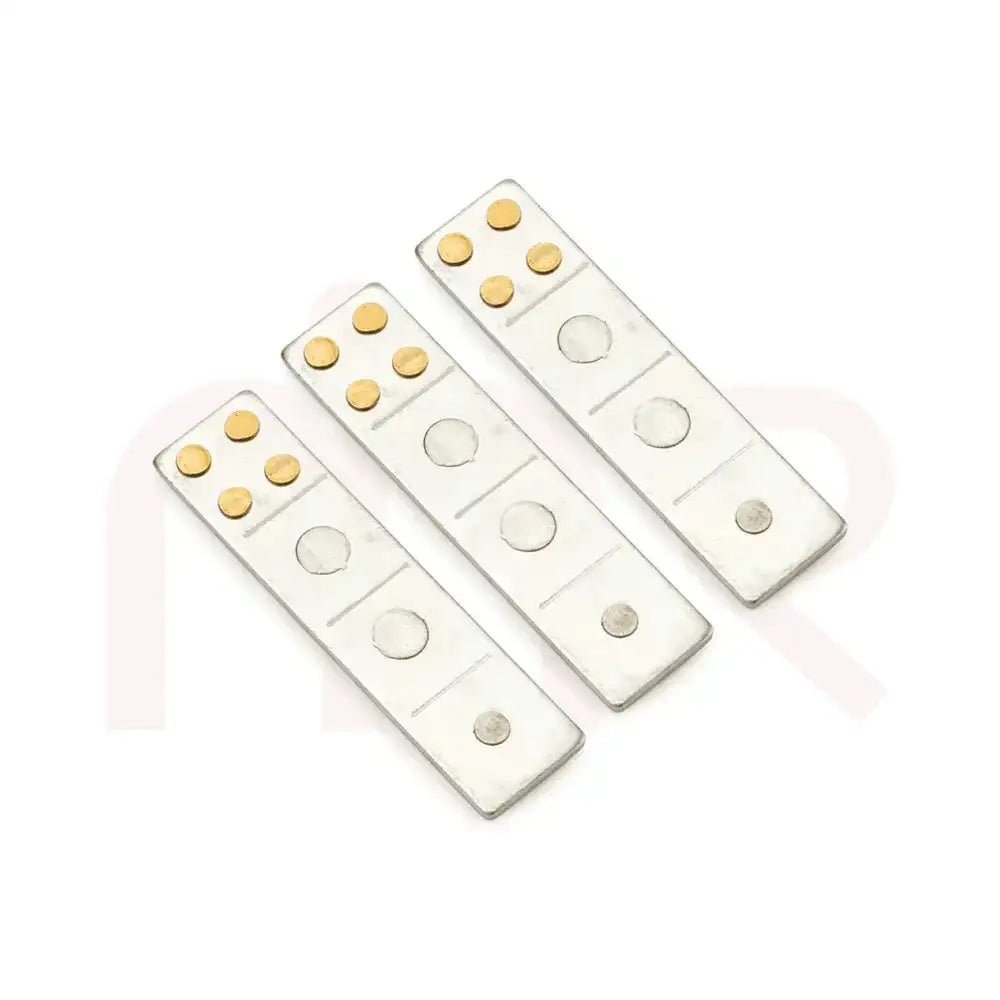 Set of silver metal strips with gold dots for Vastu Shastra remedies.