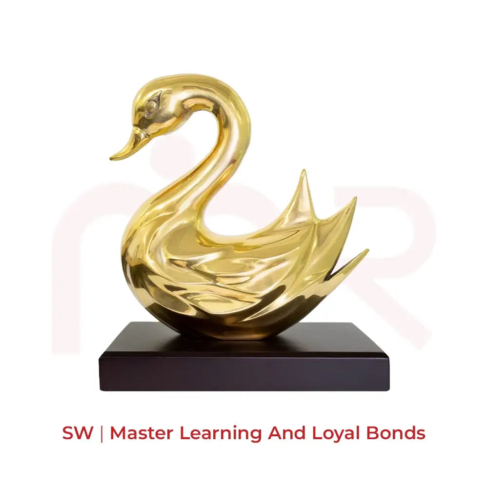 Golden swan statue on a black base for master learning and loyal bonds Vastu remedy.
