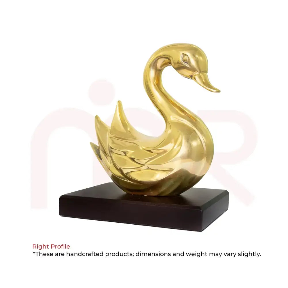 Golden swan statue on a black base for Vastu prosperity and positive energy.