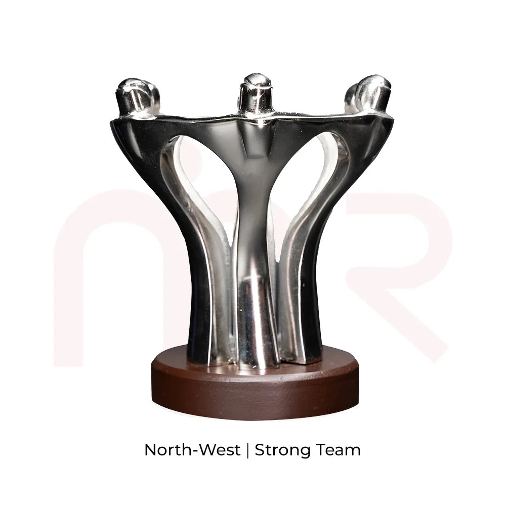 Silver teamwork figurine on round base for Vastu, symbolizing strong team energy.