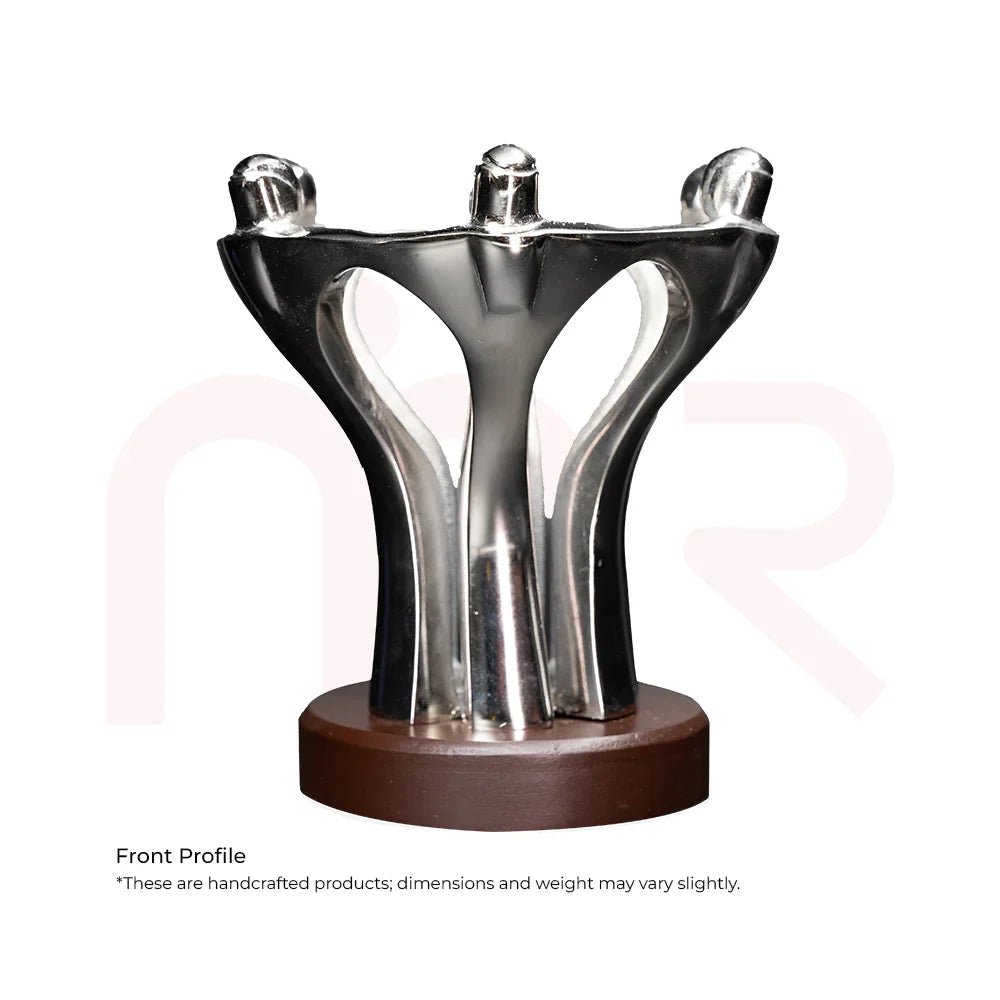Silver metal teamwork statue on wooden base, symbolizing unity and harmony for vastu decor