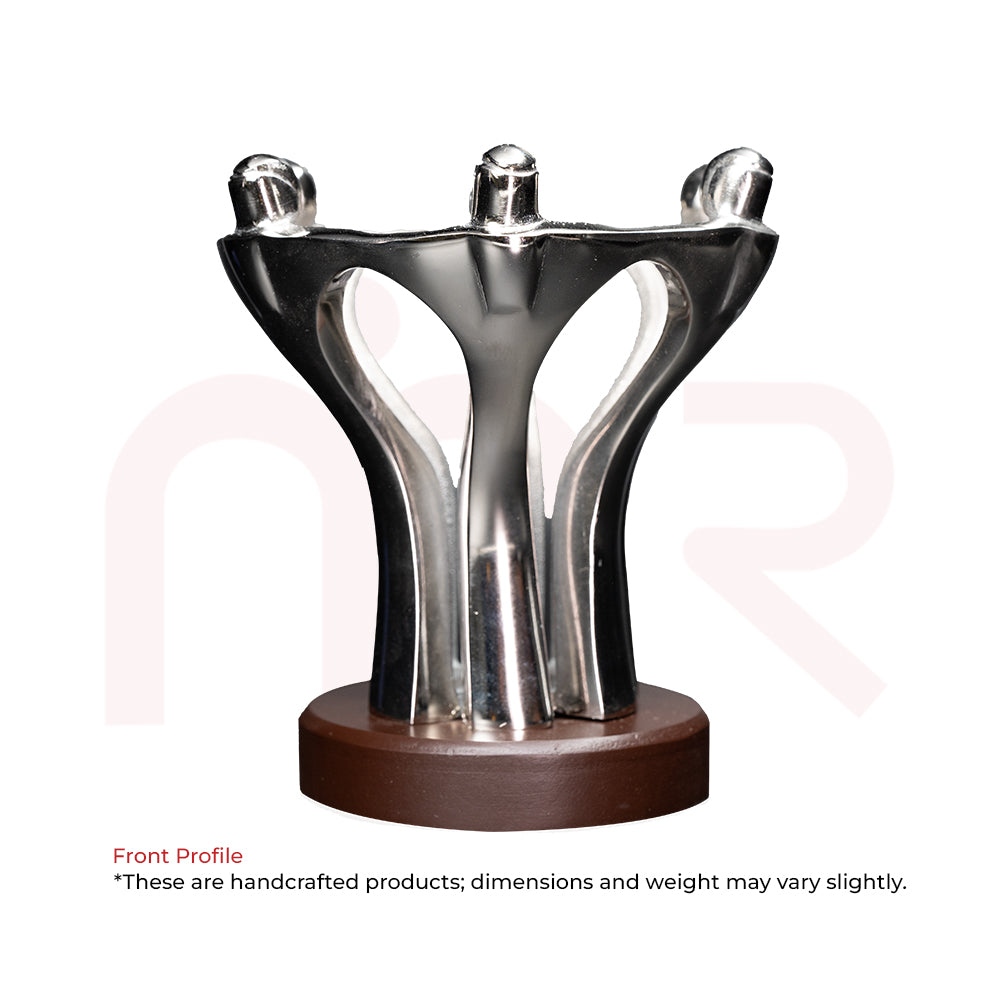 Silver metal teamwork statue on wooden base, symbolizing unity and harmony for vastu decor