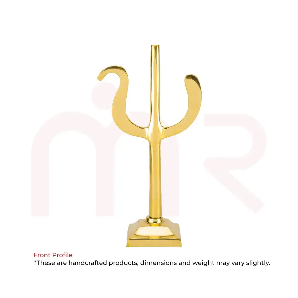 Golden metal trident Vastu remedy for positive energy and prosperity.