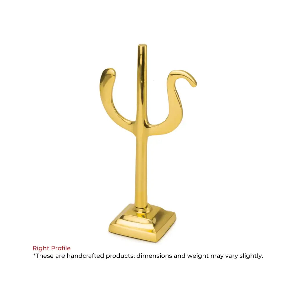Golden brass trident Vastu remedy symbol on a square base.