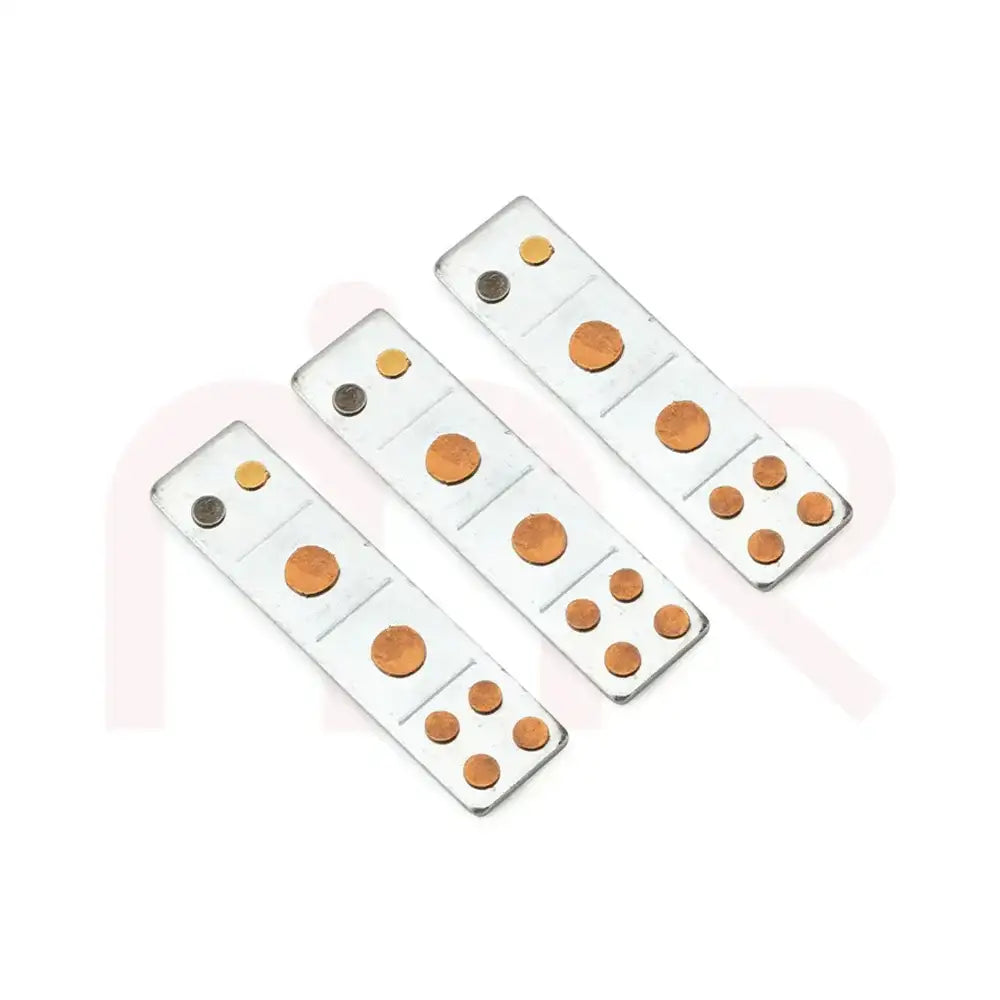 Three Vastu metal strips with copper and brass discs for space energy balancing.