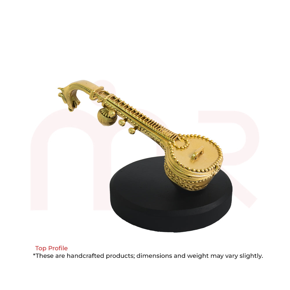 Handcrafted brass veena idol on ornate round base, Vastu decor for positivity and harmony