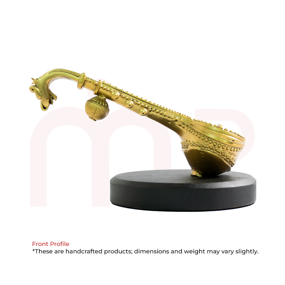 Handcrafted golden veena idol with ornate design on decorative base for Vastu remedy