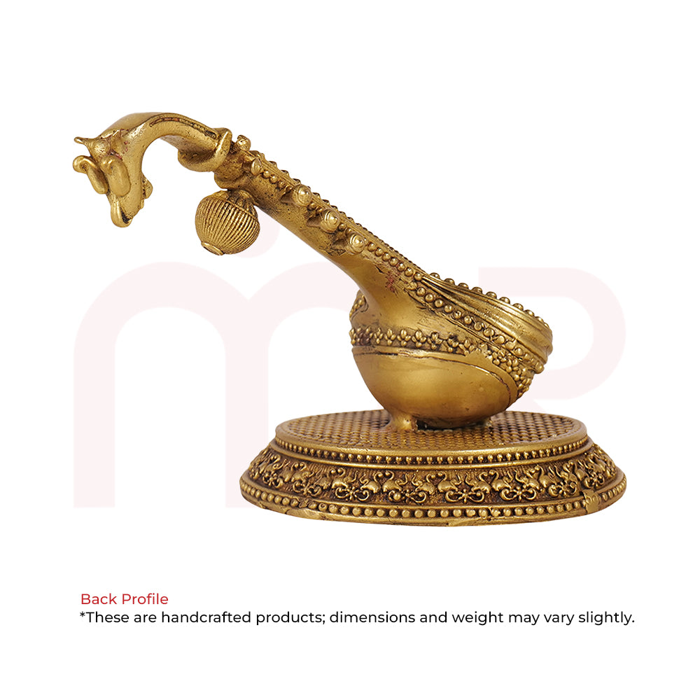 Handcrafted brass Veena idol on ornate round base, ideal for Vastu remedies and home decor.