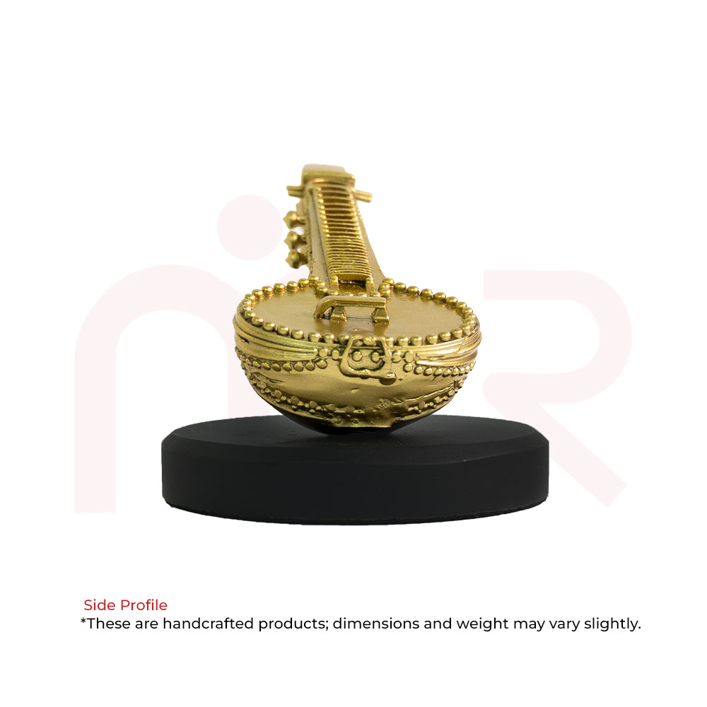 Handcrafted brass Veena idol on ornate round base, ideal for Vastu remedies and home decor.