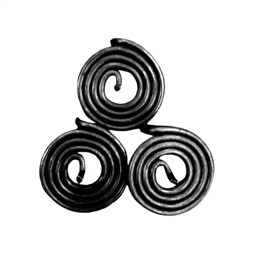 Three black spiral metal strips for Vastu remedy and energy balancing.