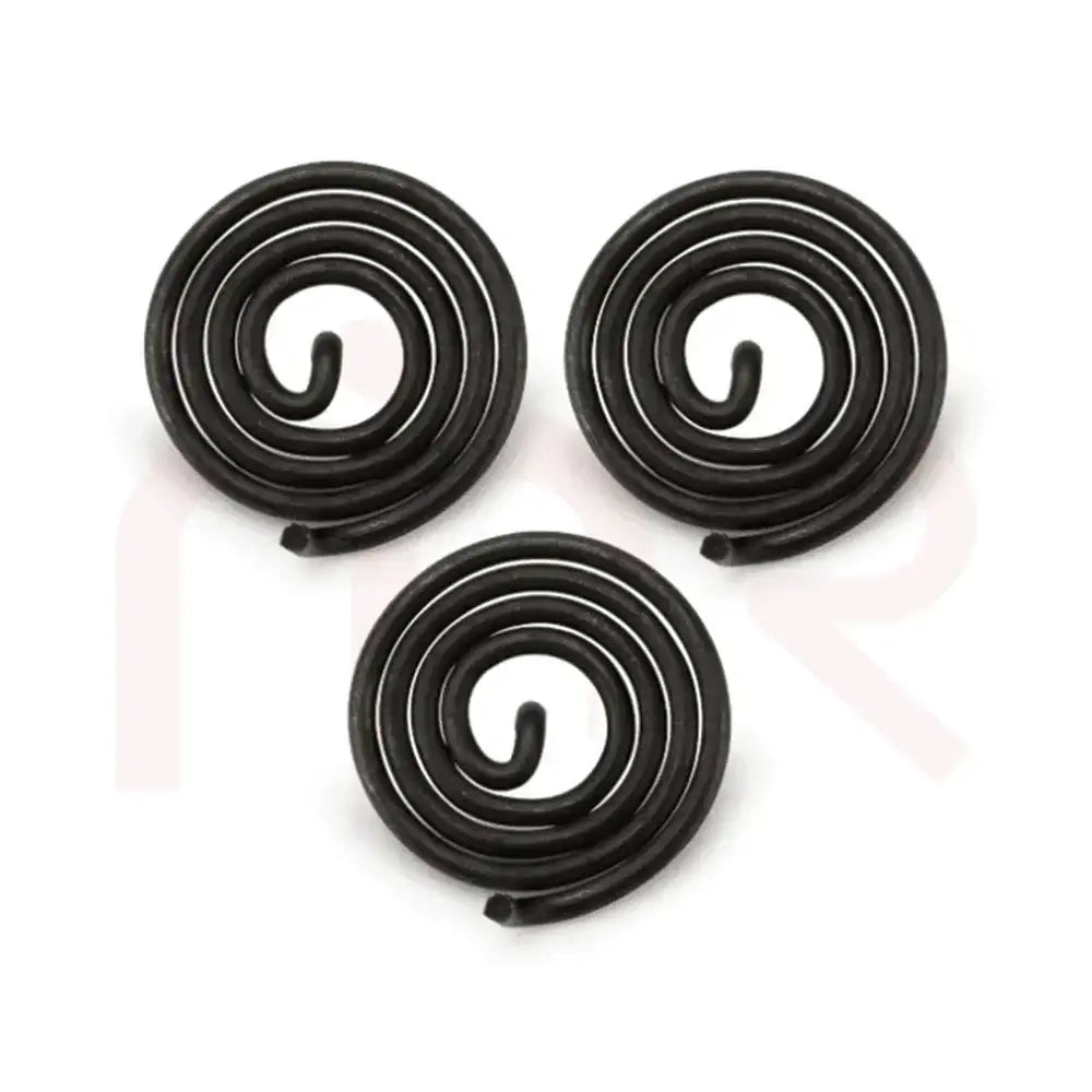 Three black metal strip spirals for Vastu Shastra remedies and energy balancing.