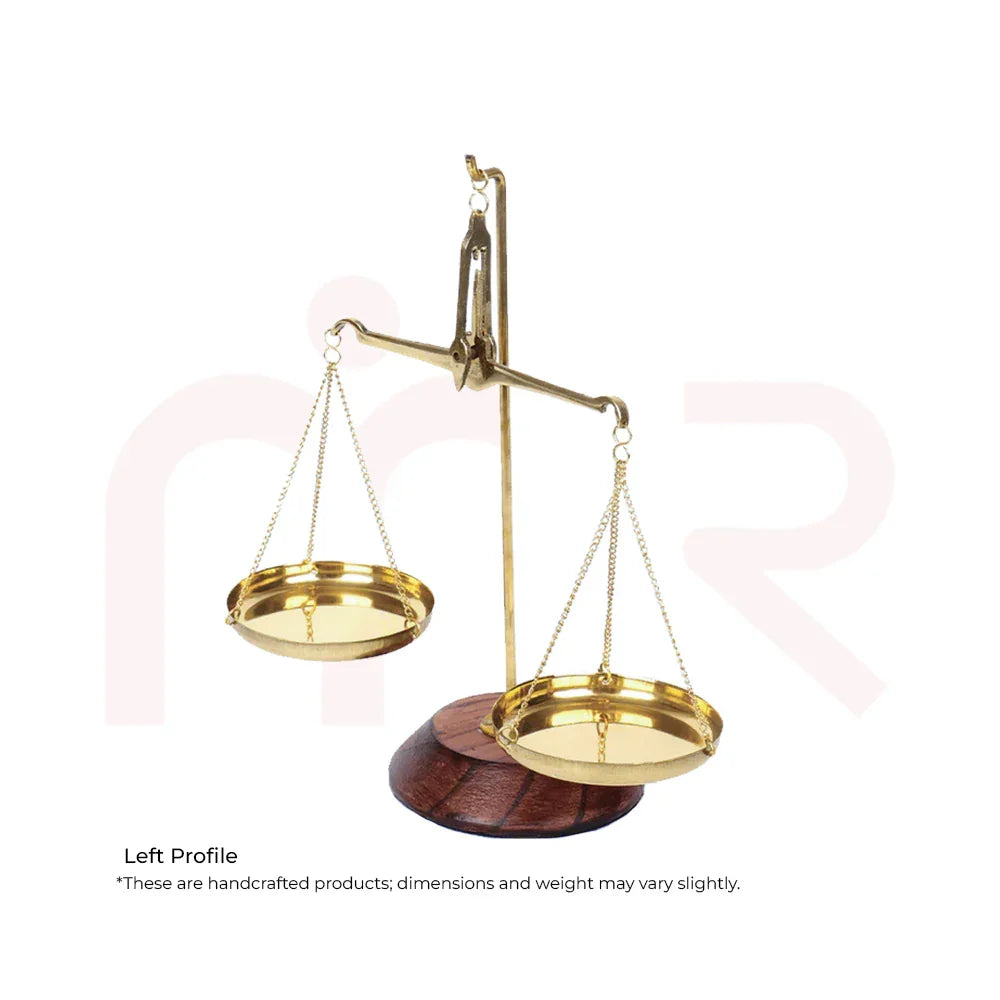 Brass decorative weighing scale on wooden base, Vastu Shastra remedy for balance and prosperity