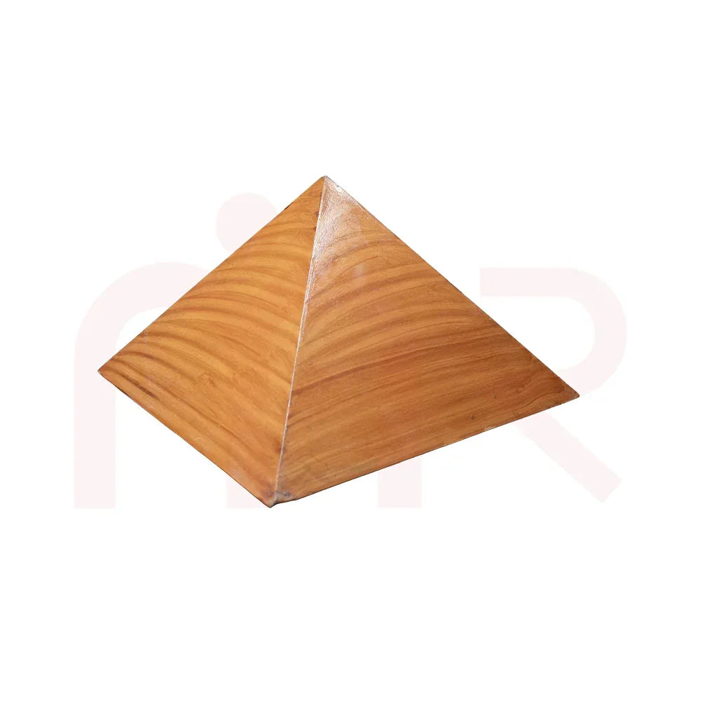 Wooden pyramid vastu remedy with smooth finish on white background for energy balance
