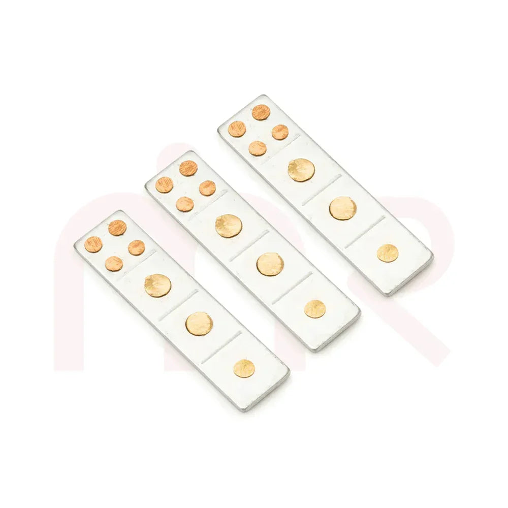 Three Vastu metal strips with gold-colored circles for Maha Vastu remedies on white background