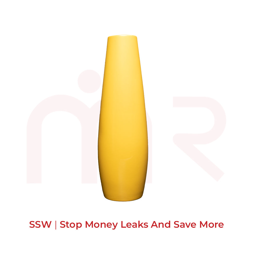 Tall yellow vastu remedy vase for positive energy and financial balance, isolated on white background
