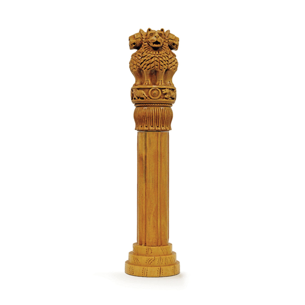 An intricately carved Statue of Ashoka Pillar with a majestic lion emblem at the top, designed in accordance with vastu shastra principles for promoting positive energy flow